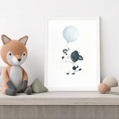 Affiche encadrée vache avec un ballon bleu